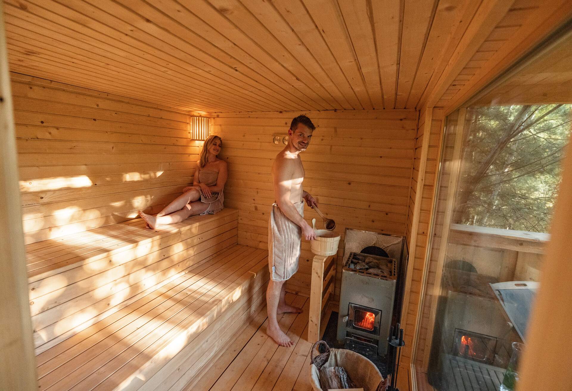 THEME_SPA_WELLNESS_FINNISH_SAUNA_PEOPLE_COUPLE_GettyImages-1453388419
