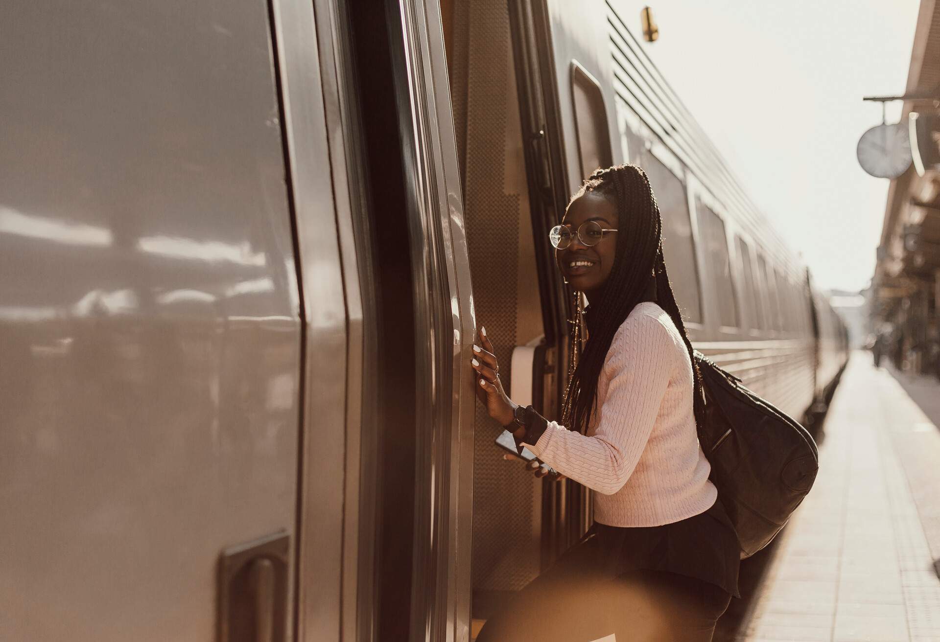 A solo female traveller enters the train.