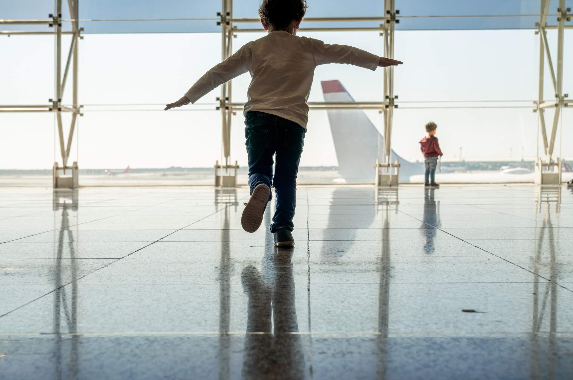 theme_airplane_aircraft_airport_people_kids_boys_gettyimages-1145832731_universal_within-usage-period_91727.jpg