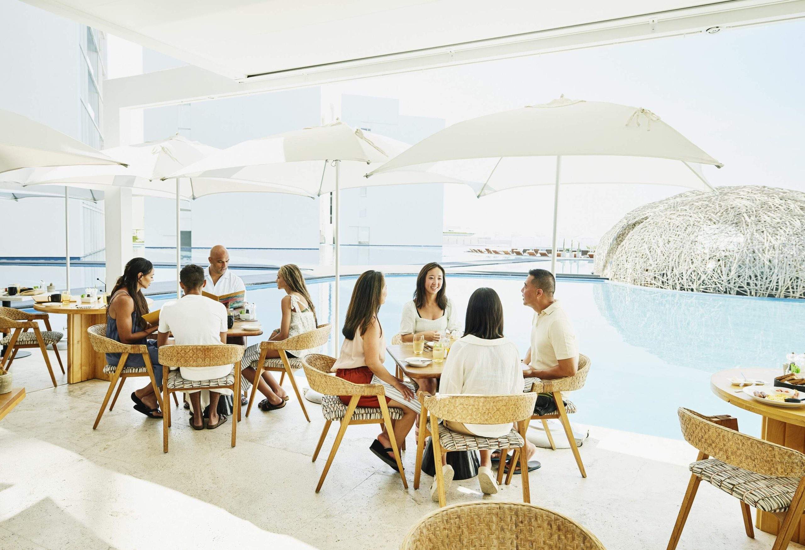 theme_people_family_hotel_resort_restaurant_pool_gettyimages-1445292174_universal_within-usage-period_100328-scaled