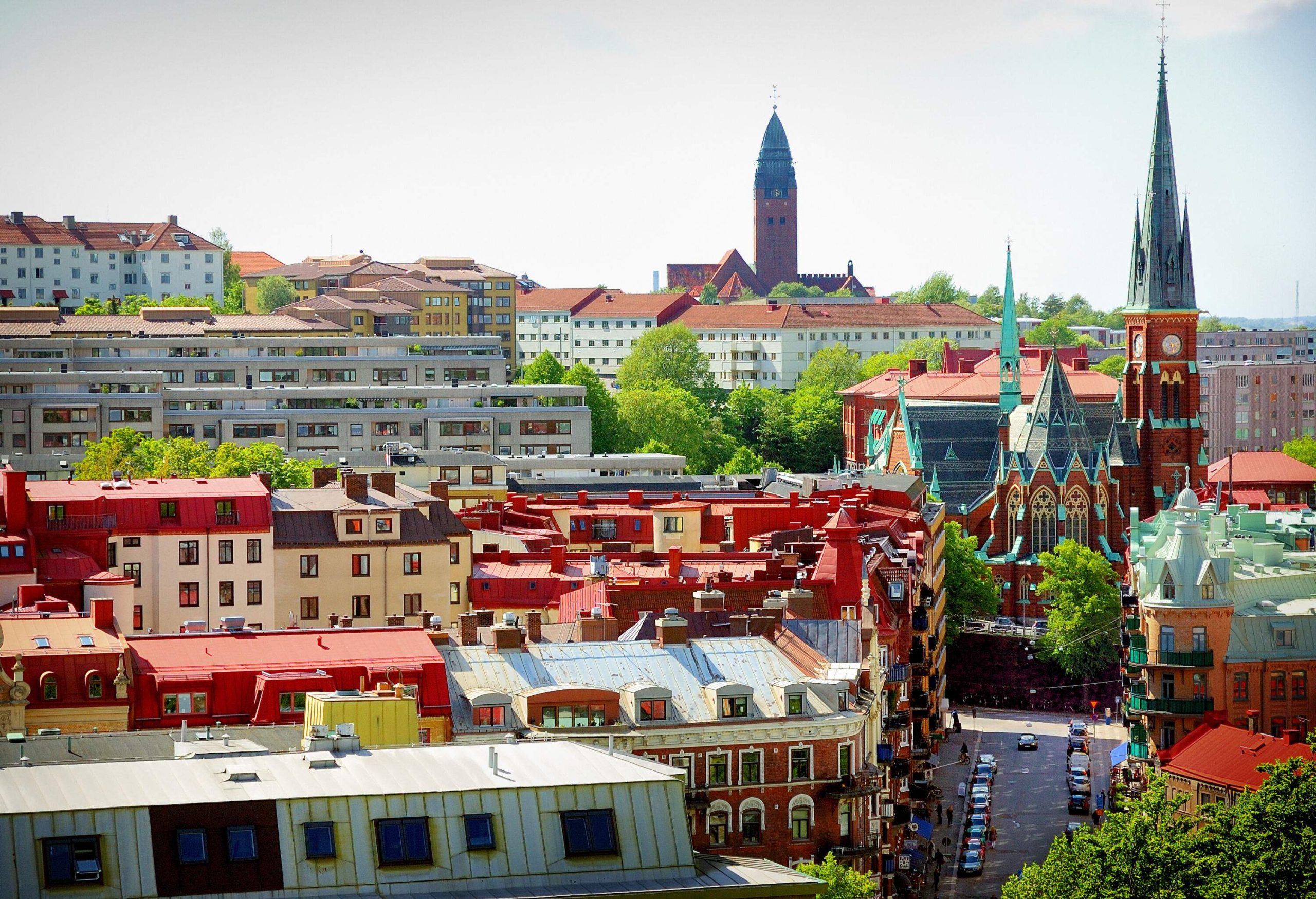 The residential structures' rooftops, featuring a spired tower.