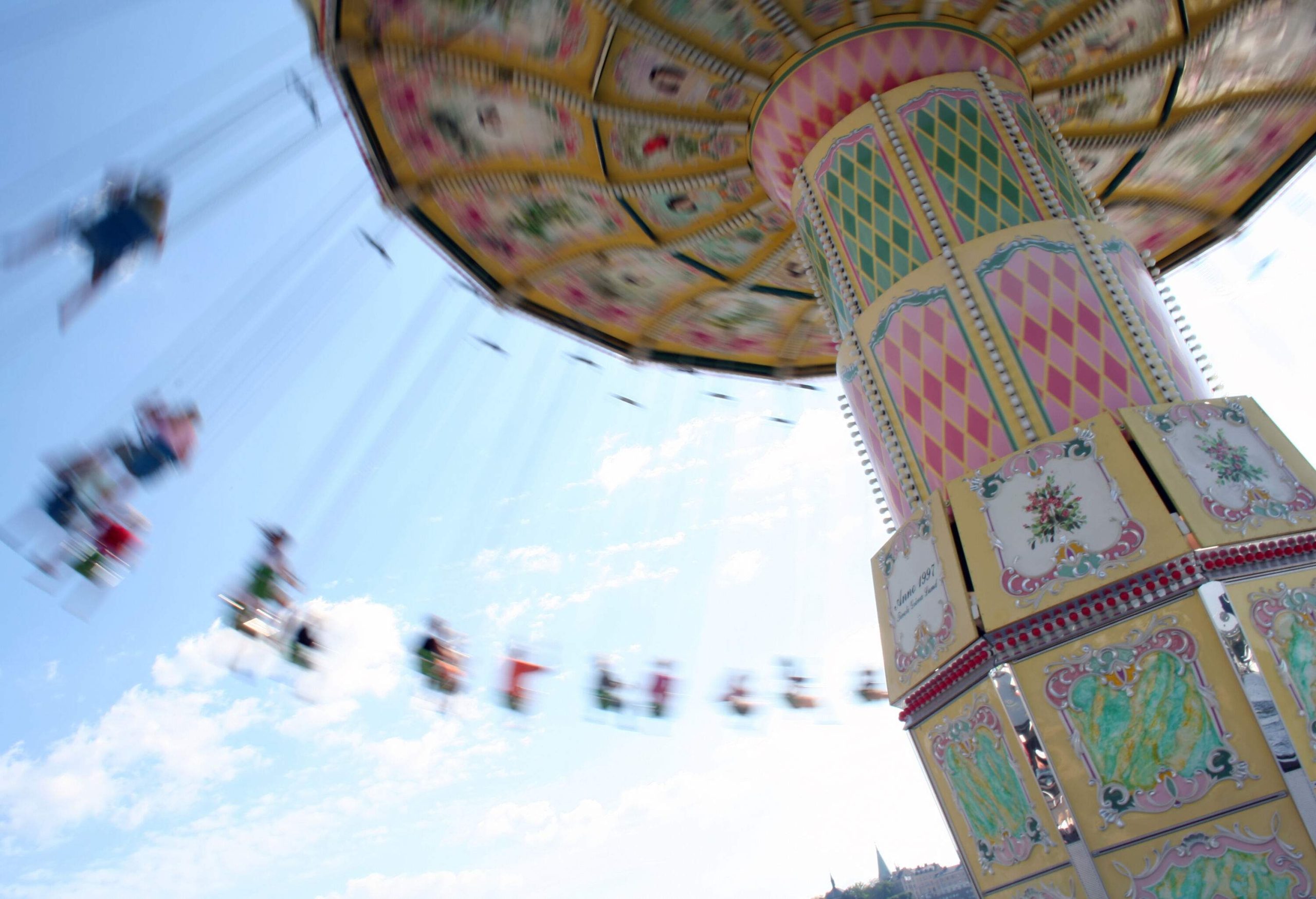 Riders on a swing carousel.