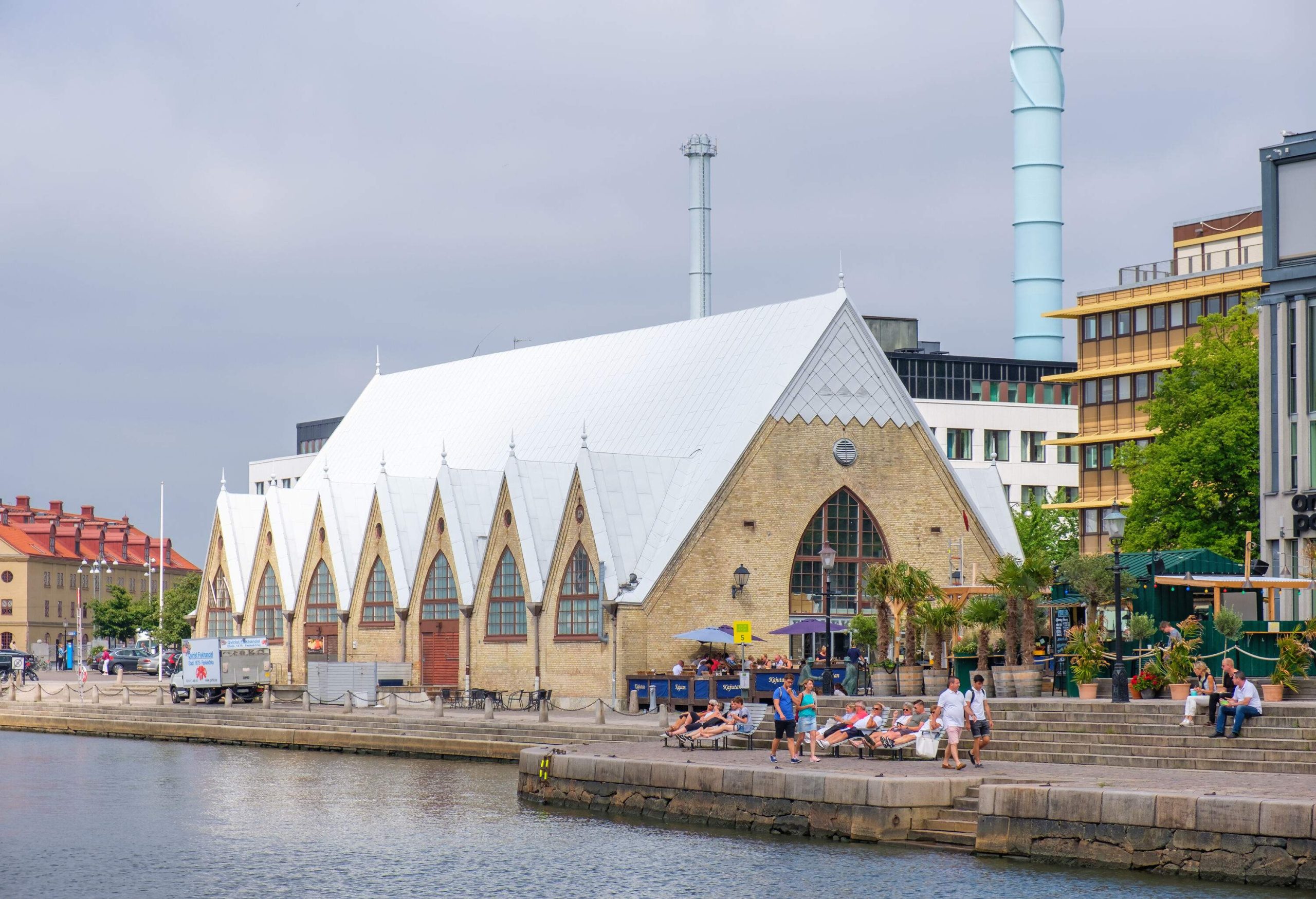 An iconic indoor fish market resembling a Gothic church with arched windows under a steeply pitched roof.