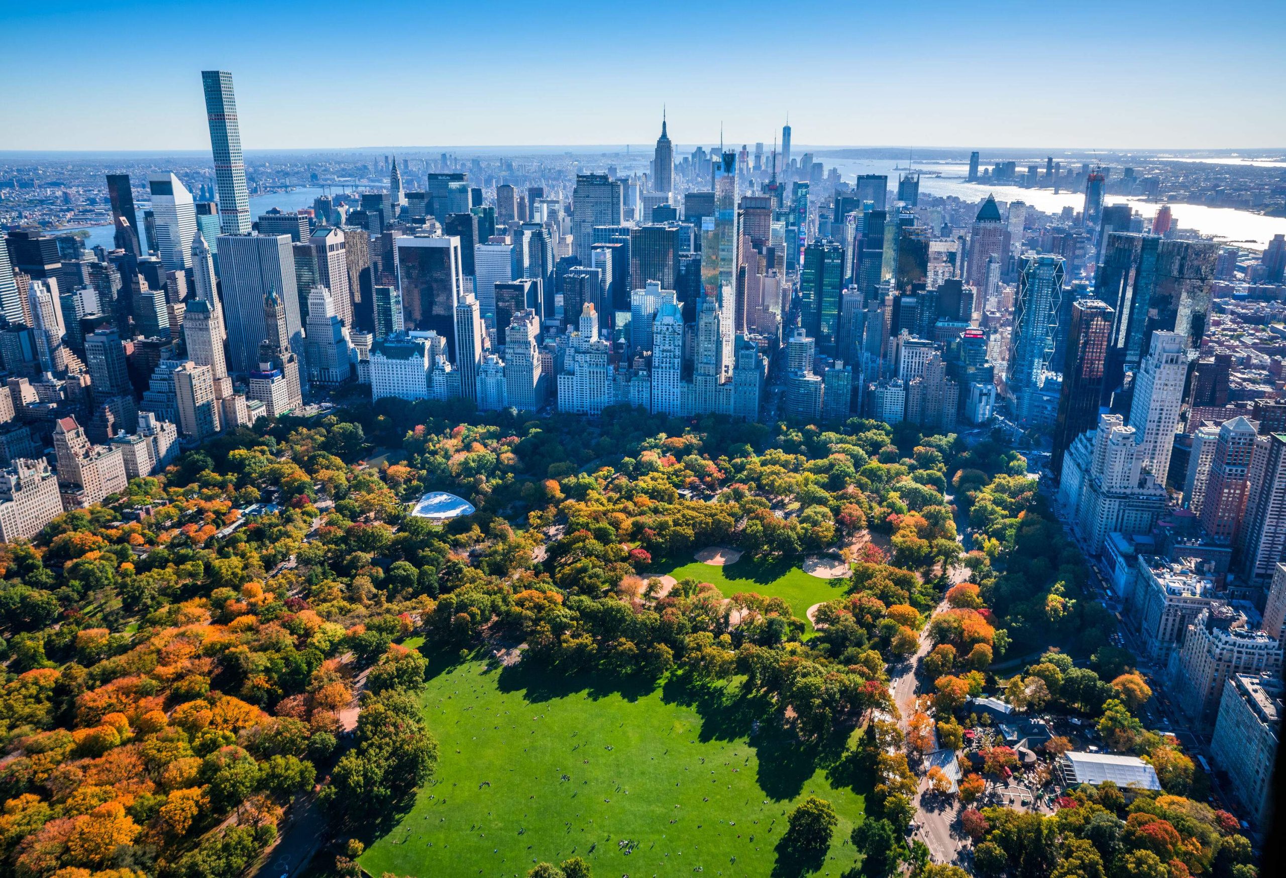 A city park surrounded by high-rise buildings.