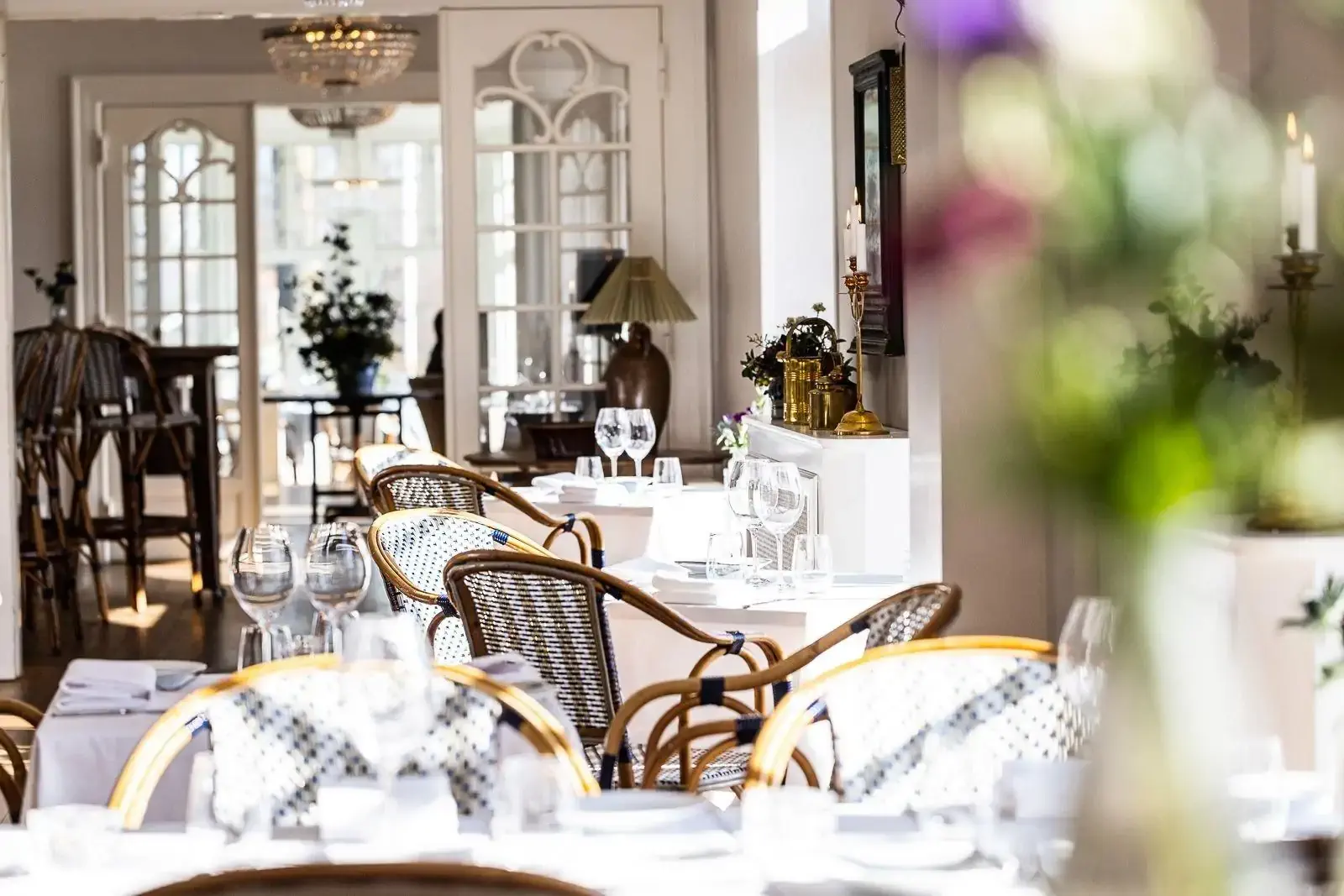 Tables set in an opulent restaurant