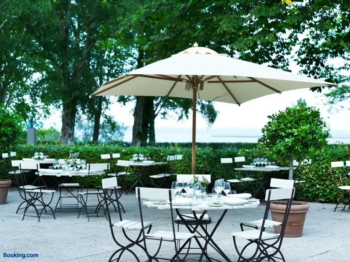 Terrace of a hotel with tables and sun shades