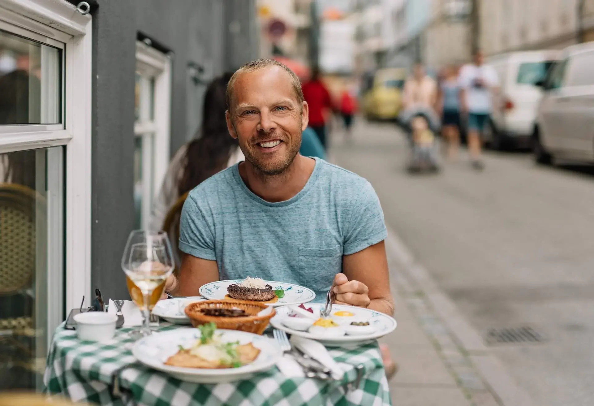 DEST_DENMARK_COPENHAGEN_THEME_PEOPLE_MAN_RESTAURANT_FOOD_DANISH_OPEN_FACED_SANDWICH_GettyImages-585288310