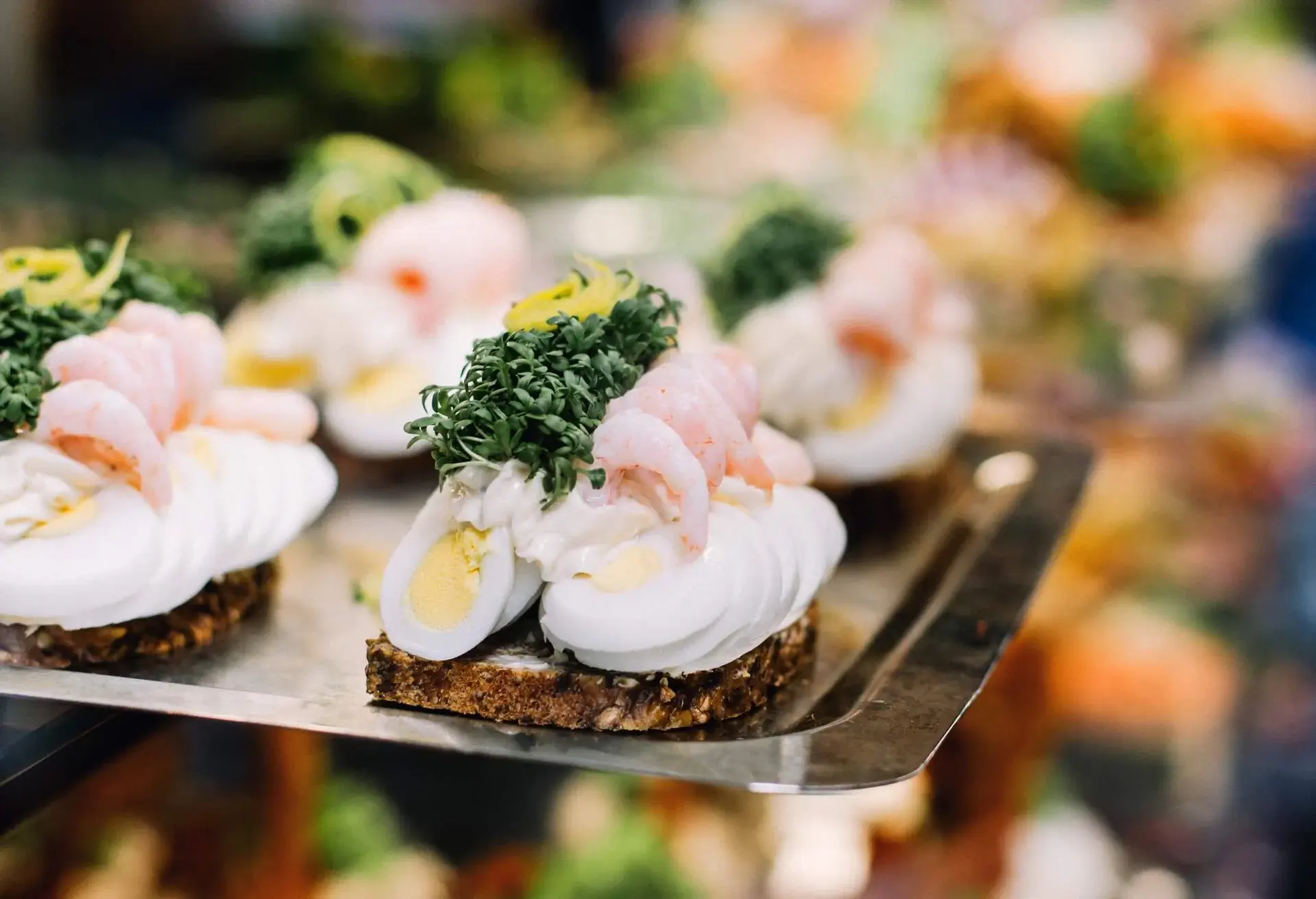 Open faced sandwiches on a ceramic plate in Copenhagen, Denmark