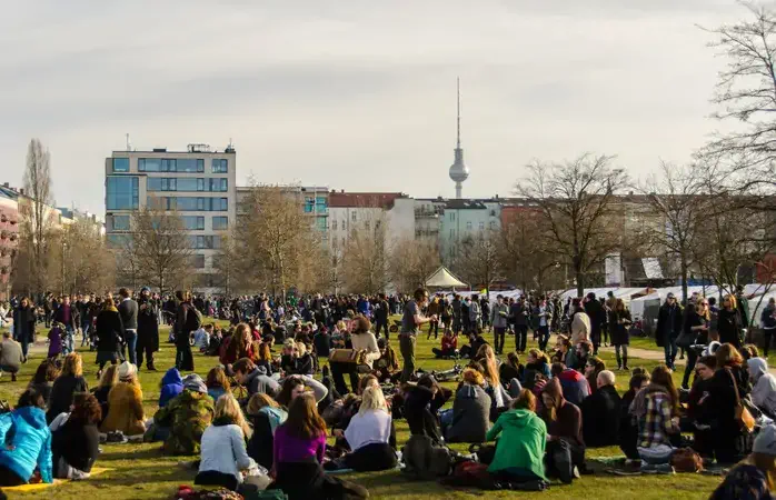People enjoying a sunny Sunday afternoon in Mauer (Wall) Park in the Prenzlauer Berg area of former east Berlin.