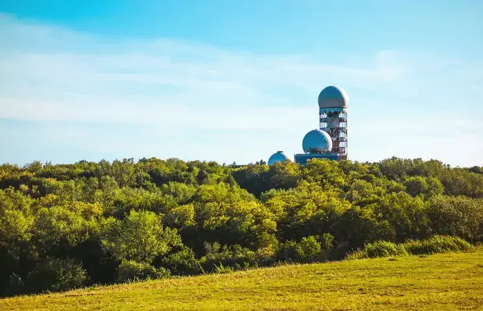 old radio station on a tree mountain; Shutterstock ID 658307494