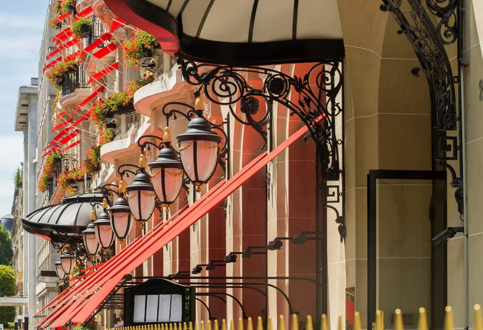 Red awnings at the front of a five stars hotel at Avenue Montaigne in Paris city, France. This avenue is one of the finest and elegant of Paris.