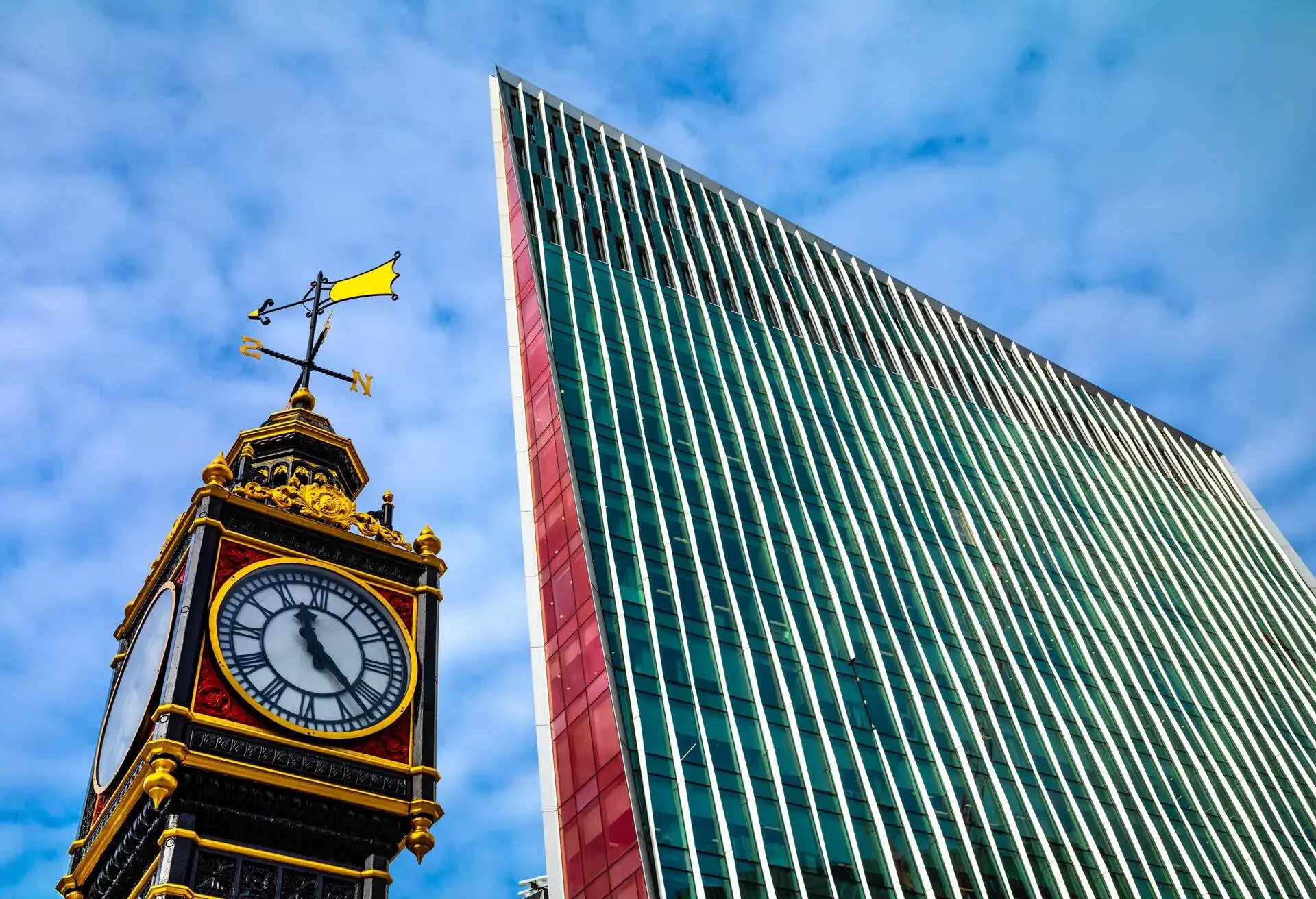 Little Ben clock next to the Nova Building, Victoria, London, UK. Little Ben was erected in 1892, and the Nova Building was voted London's ugliest building in 2017 when it was awarded the
