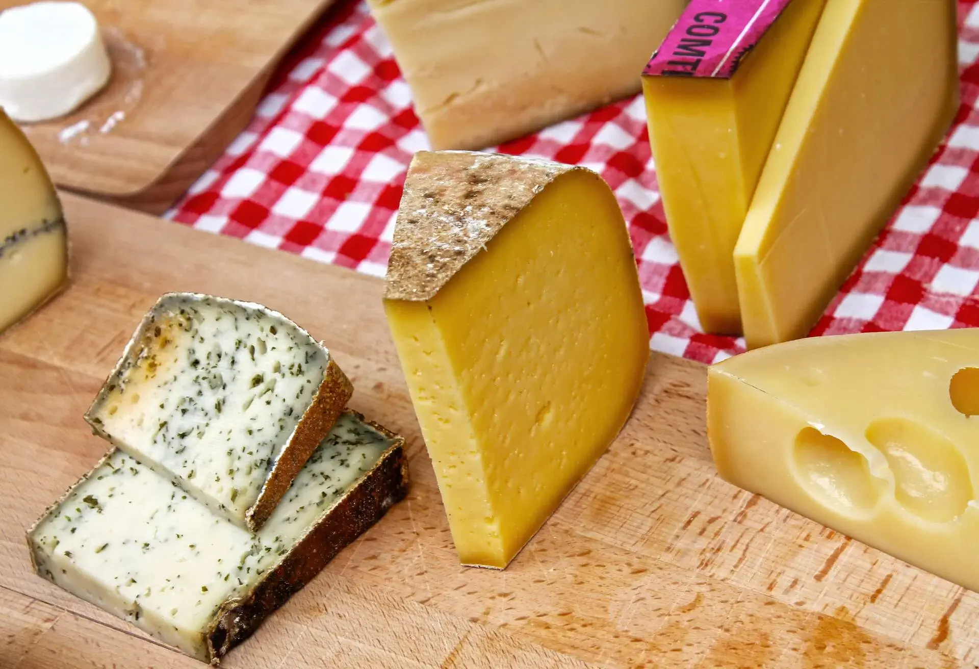 Various types of cheese on table