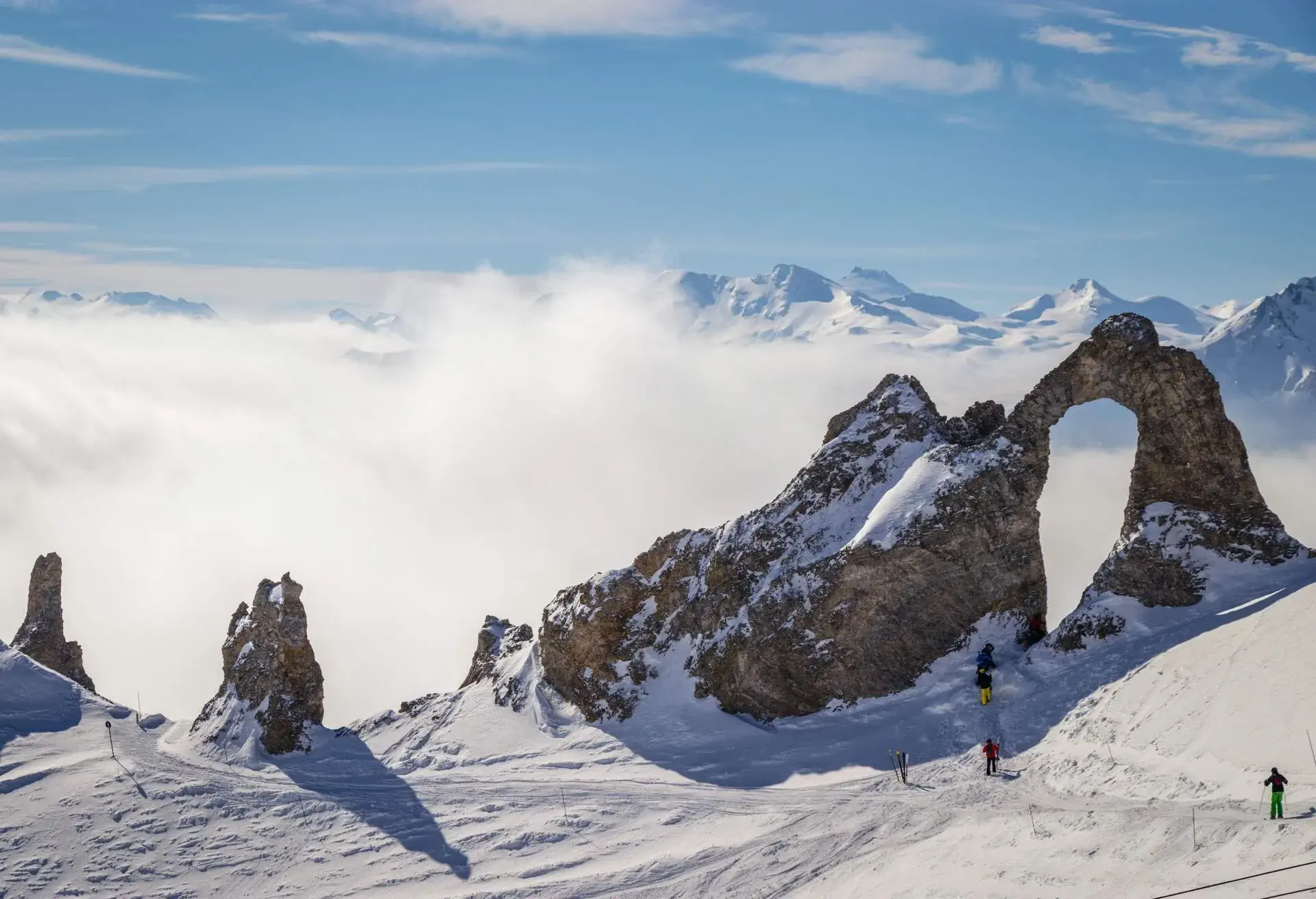 Skiiers walking to the aiguille percee in Espace Killy the ski resorts of Tignes and Val D'Isere. Espace Killy is a name given to a ski area in the Tarentaise Valley, Savoie in the French Alp
