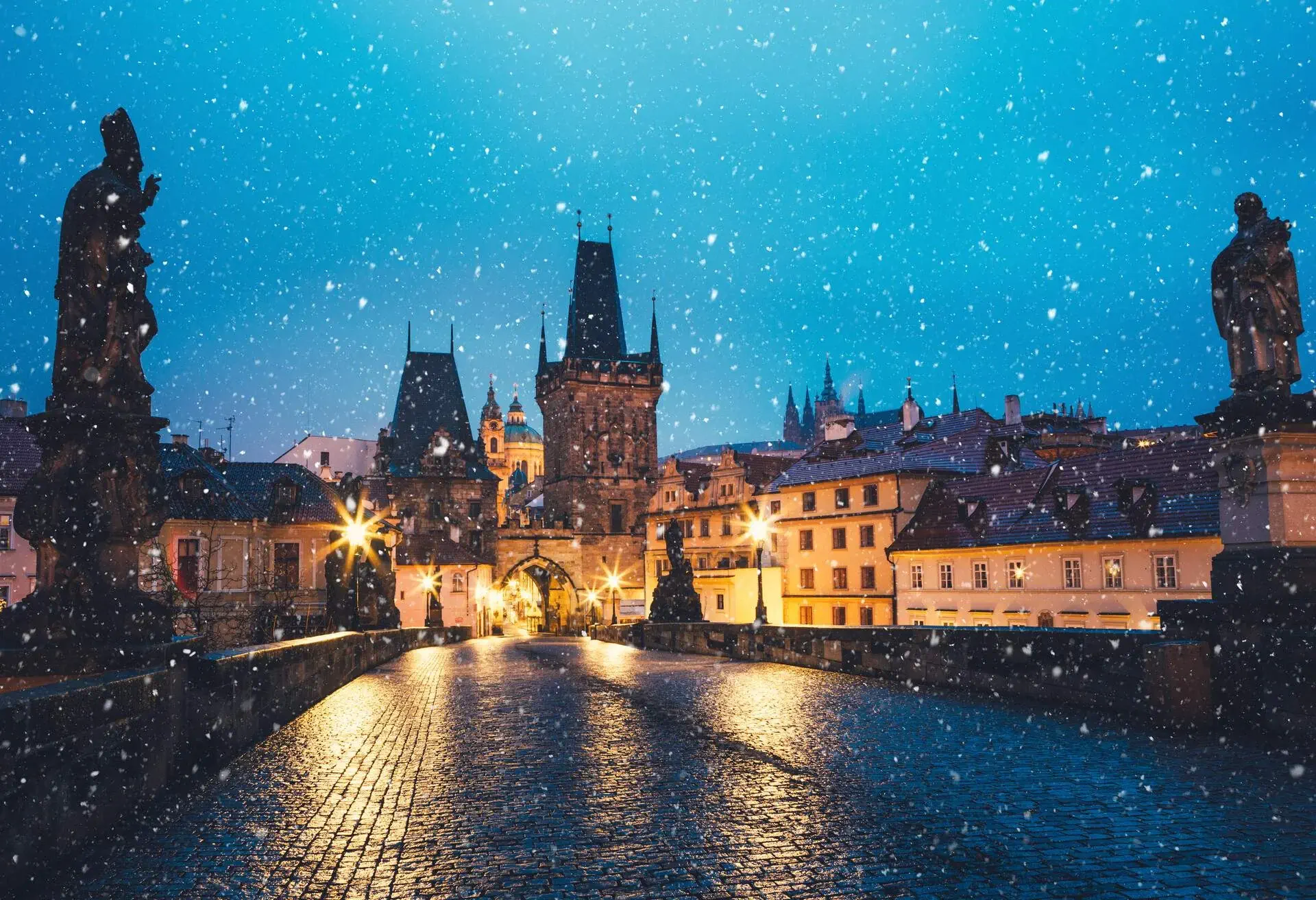 Charles Bridge in Prague on a snowy Christmas morning.