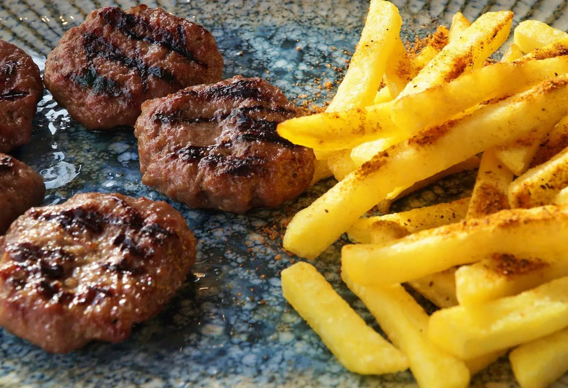 Meatballs and French fries in plate in Galataport in Istanbul, Turkey.