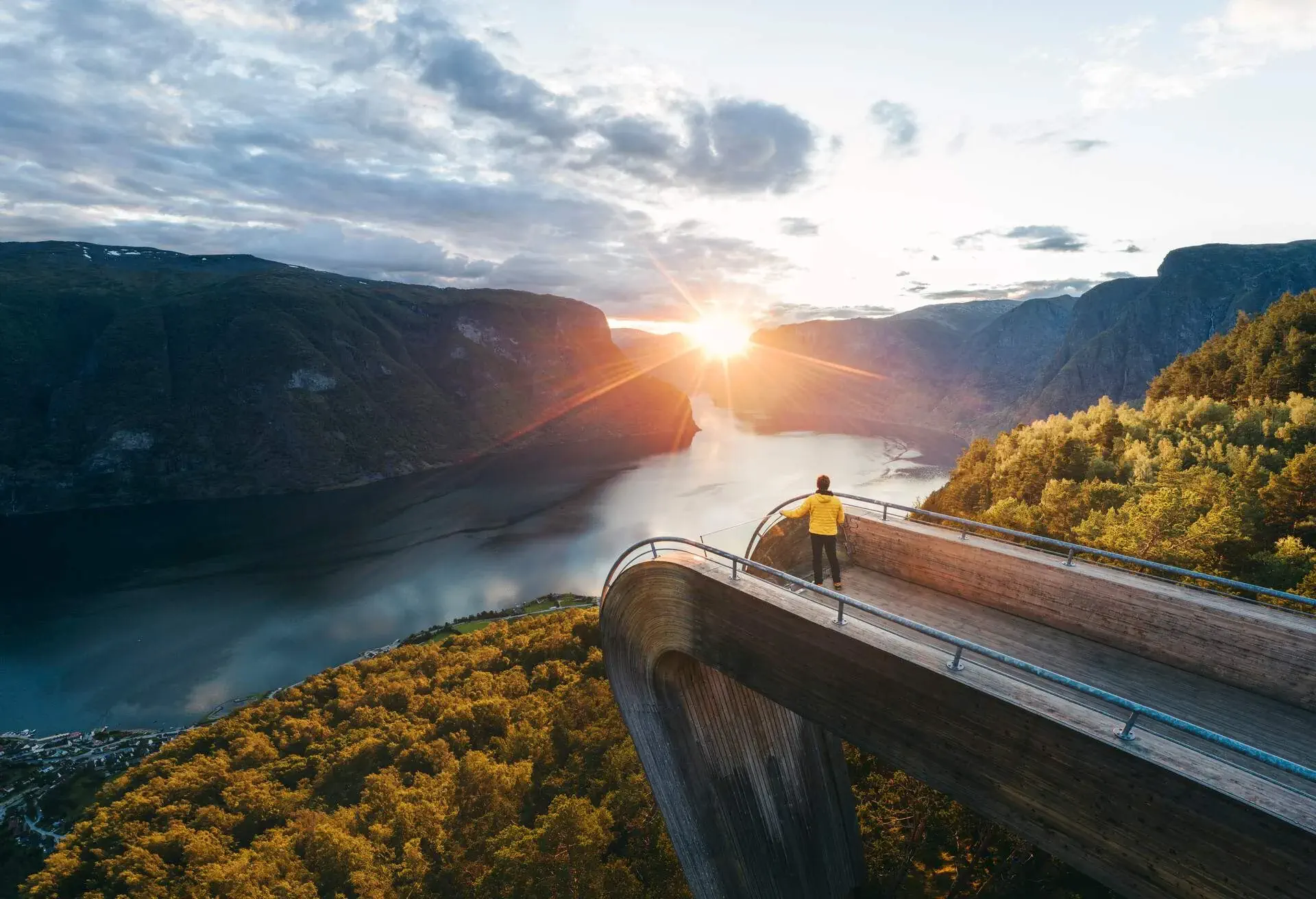 Person on the Stegastein lookout overlooking the Aurlandsfjord, a branch of the Sognefjord, Norway.