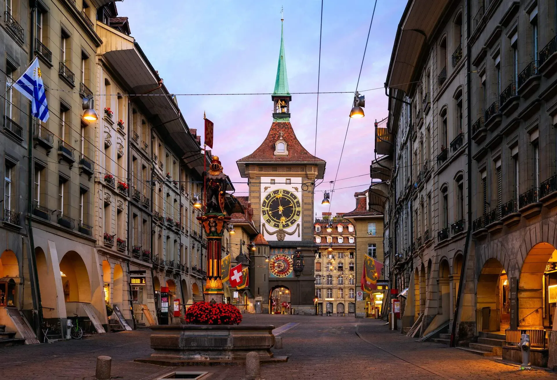 The famous Zytglogge, Astronomical Clock in Altstadt (Old Town) of Bern, the capital of Switzerland. This photograph was taken at sunrise along Kramgrasse Street