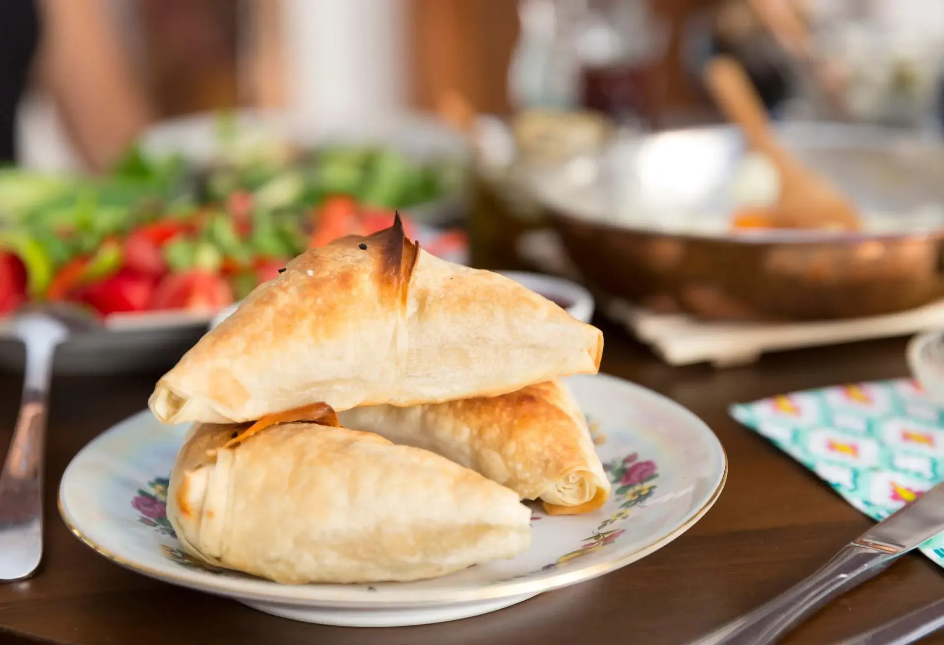 Turkish and Balkans Traditional Puff pastry with meat or cheese. Samosa or Muska Boregi is a family of baked filled pastries made of a thin flaky dough known as phyllo or yufka of Anatolian origins.; Shutterstock ID 1019375011; Purpose: ; Brand (KAYAK, Momondo, Any):