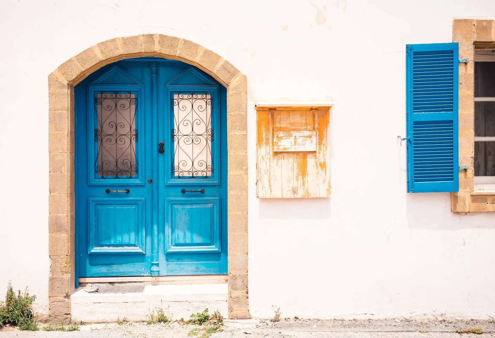 Blue door and colorful building. Old city architecture in Paphos, Cyprus