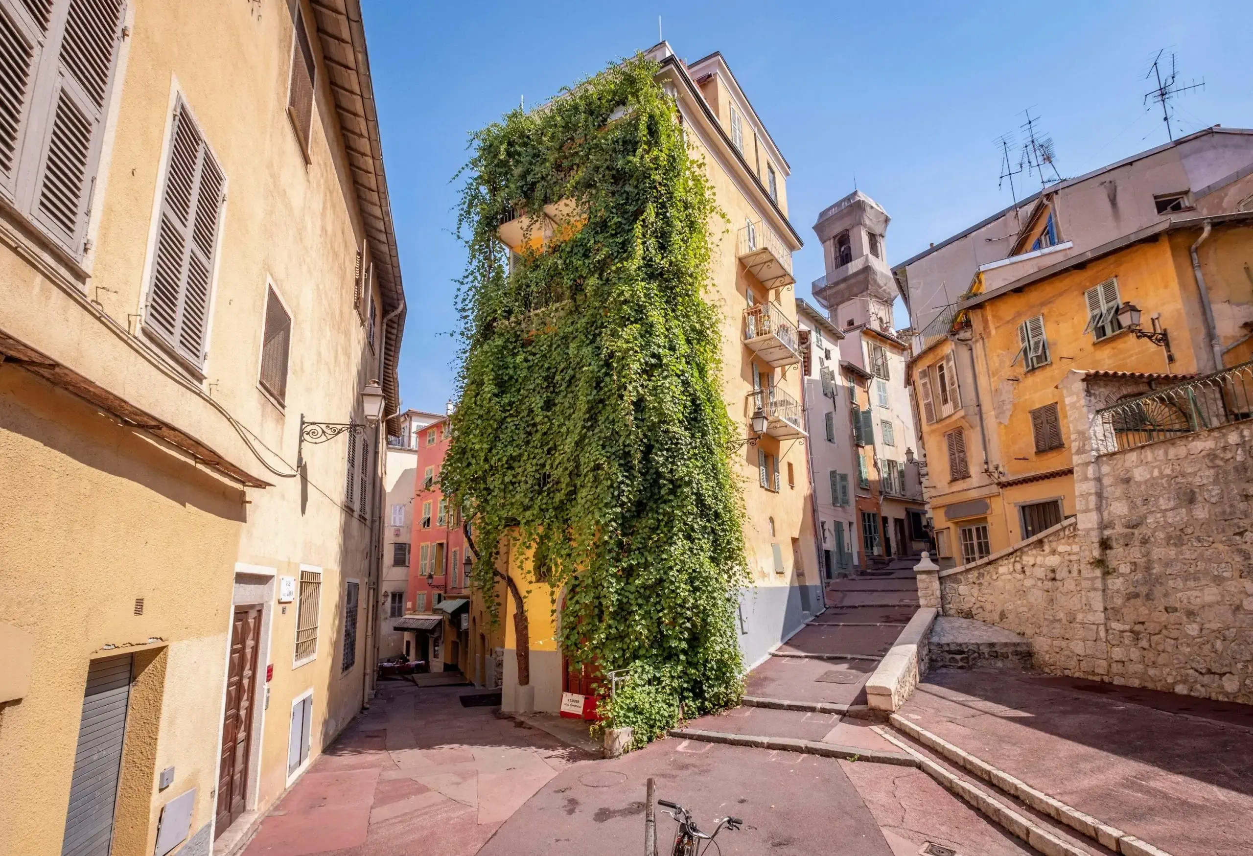 An old town with colourful and classic stone buildings with narrow streets.