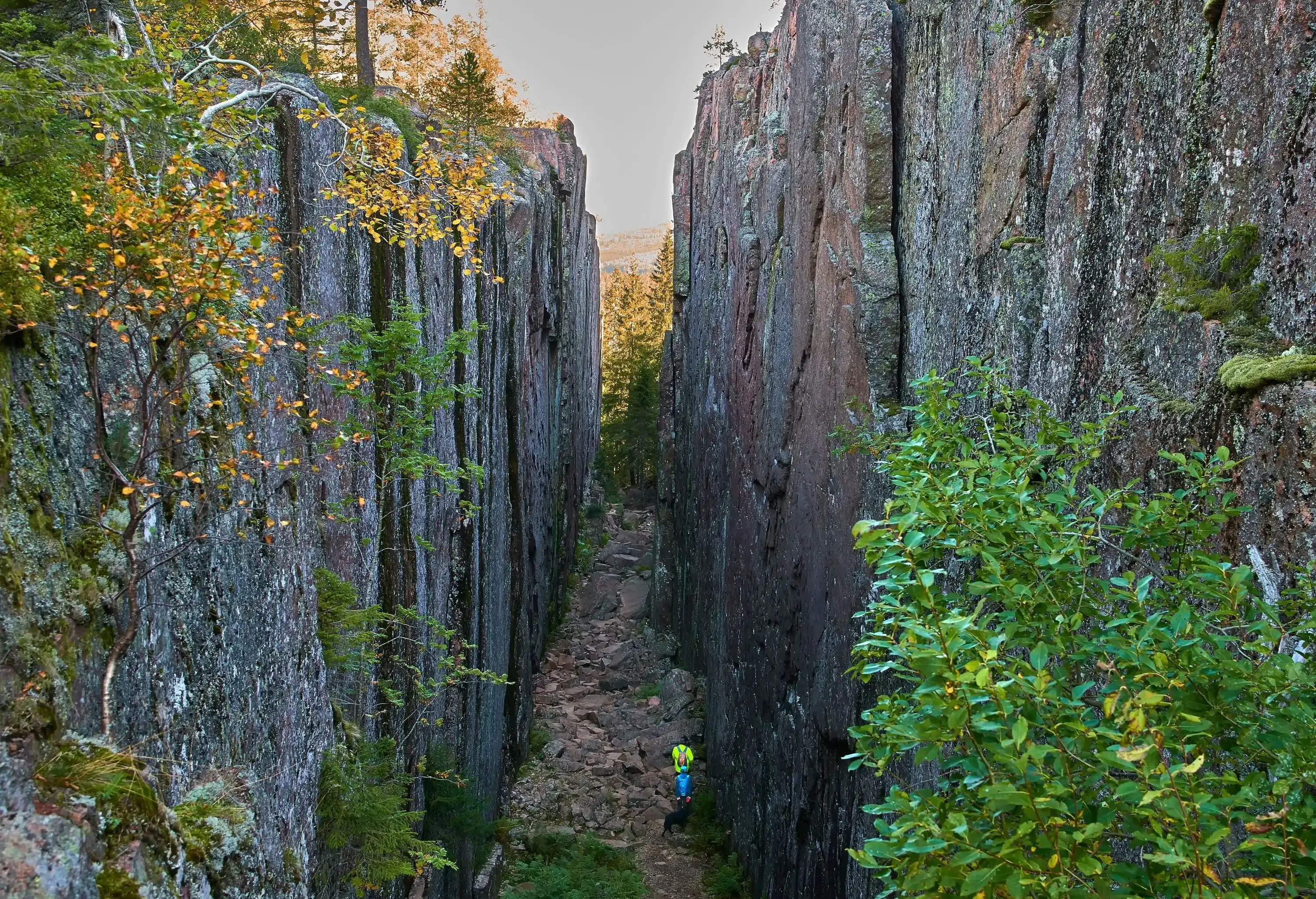 A stone fissure with a rocky trail cutting through.