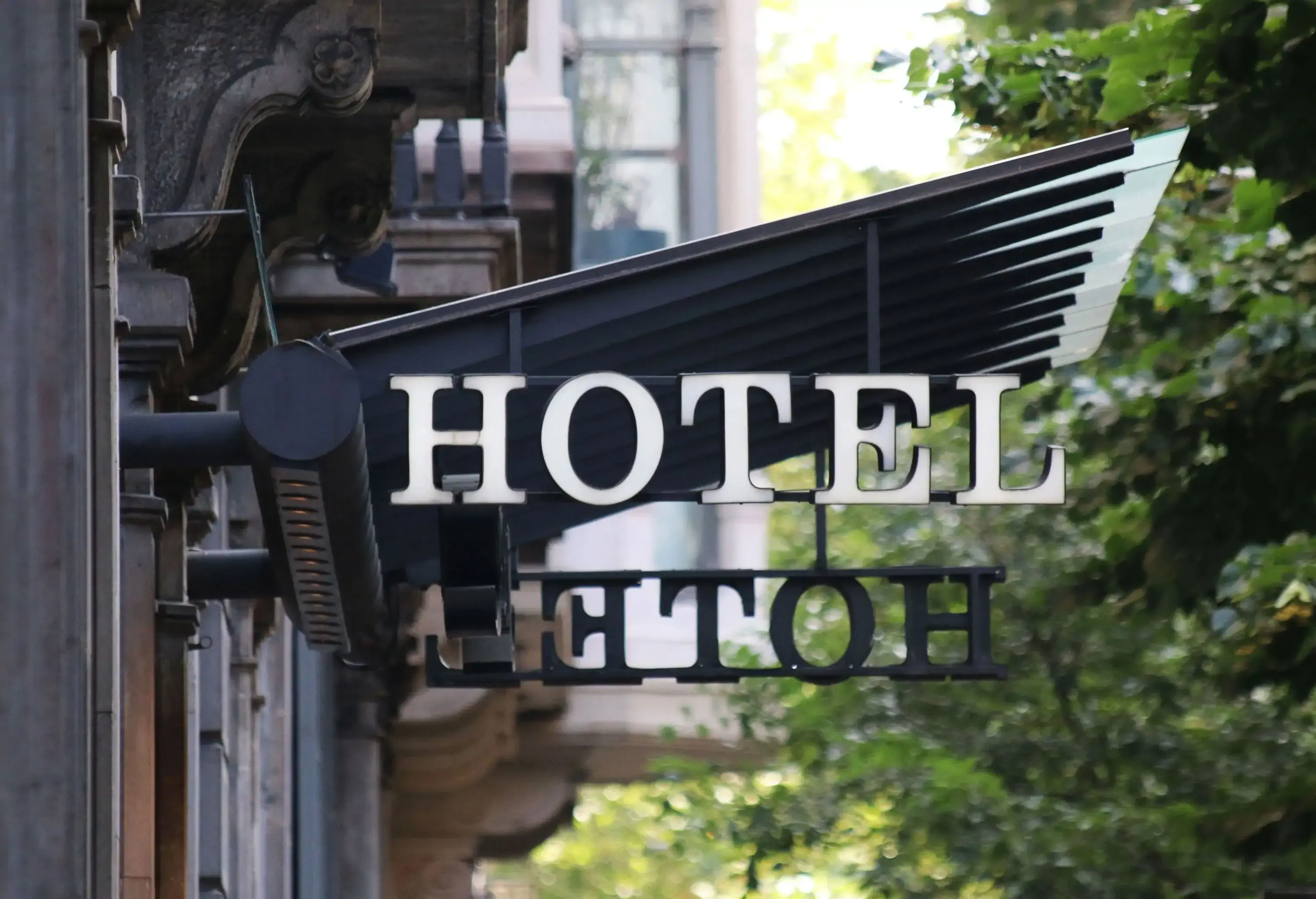 A back-to-back sign that says 'Hotel'.