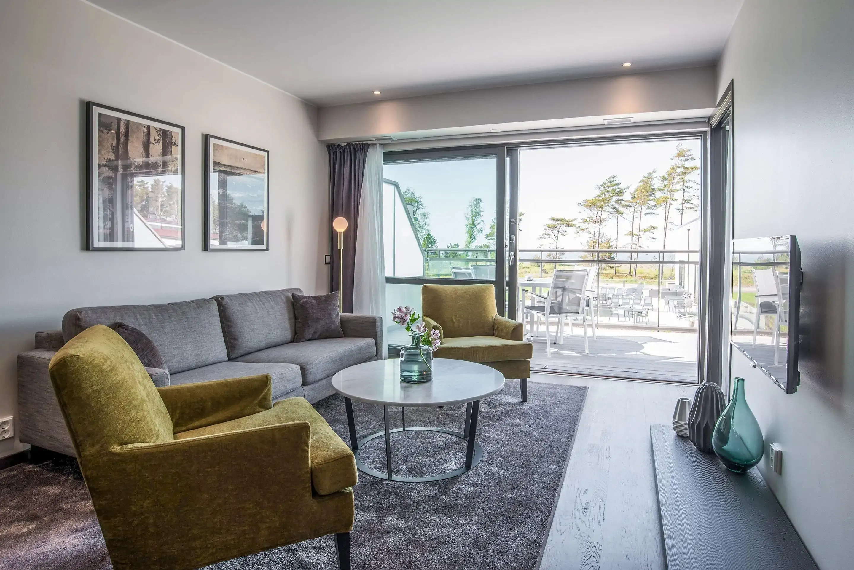 Luxury hotel suite with view over the beach through a balcony