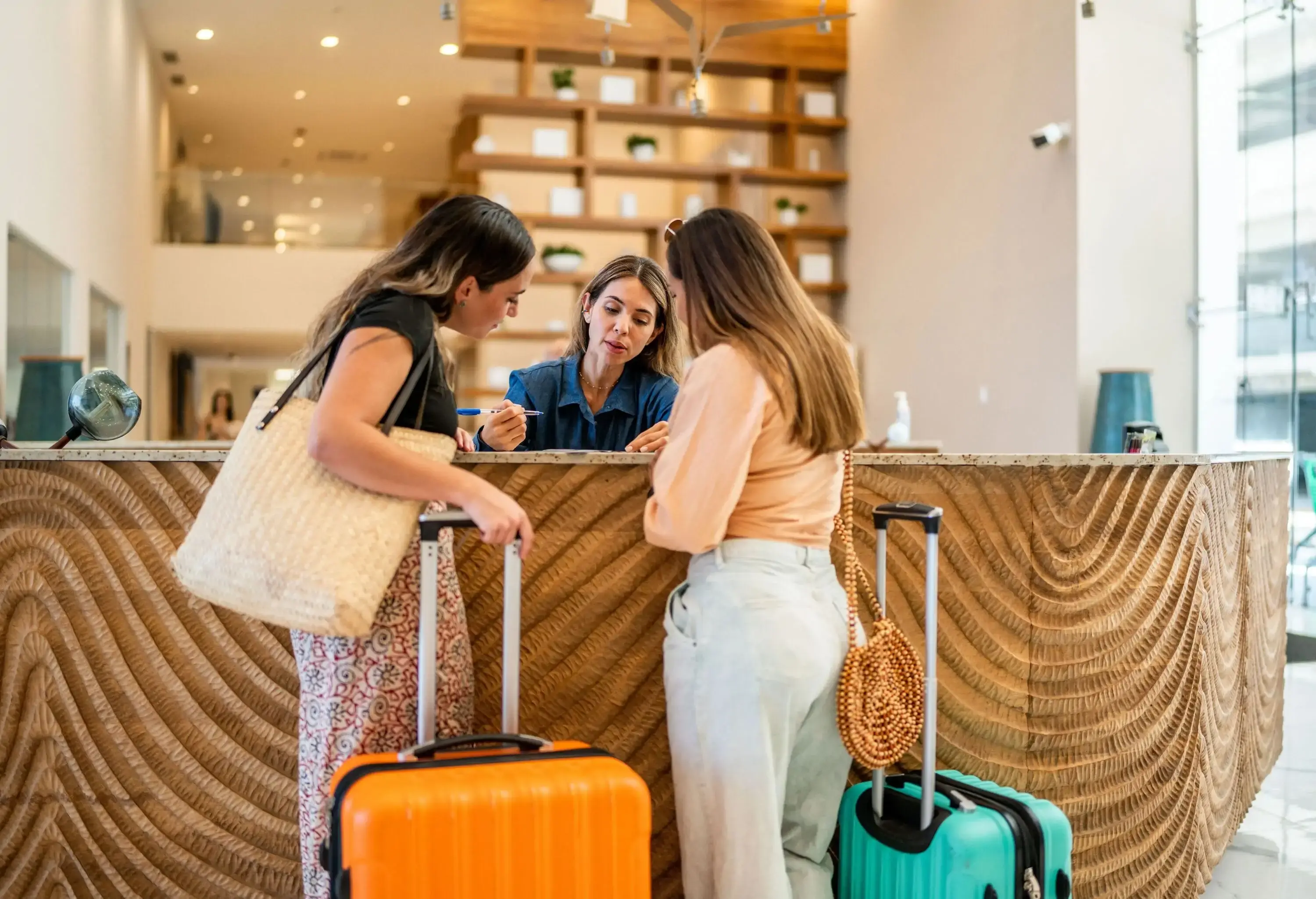 Hotel receptionist talking customers at lobby
