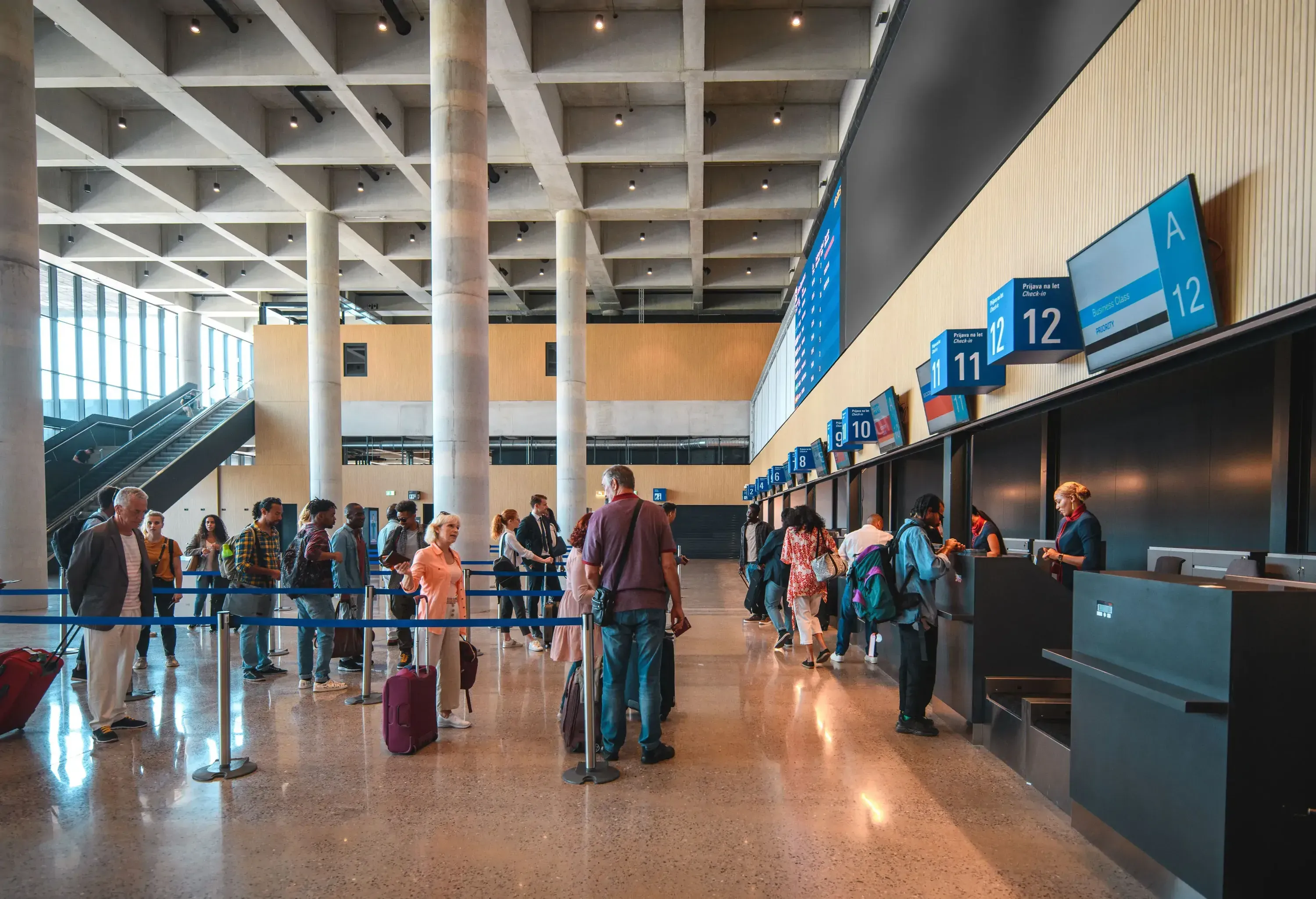 People at the airport headed to the check-in desk