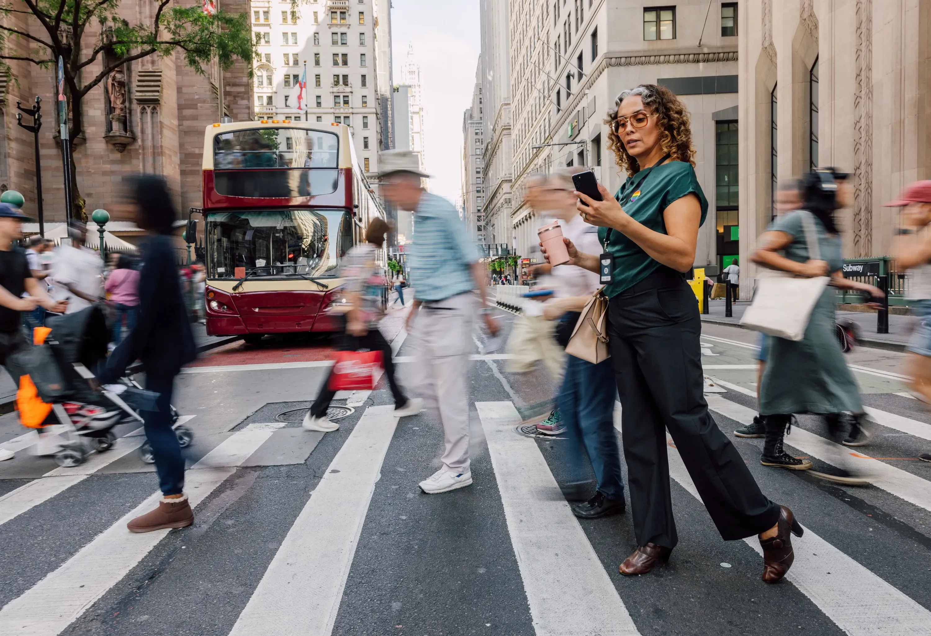 Businesswoman crossing the street to the office in the city downtown